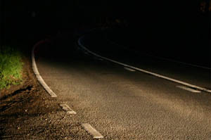 photo of a dark road at night time